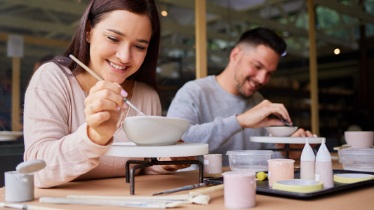 Air-dry clay crafting tools and supplies, including smooth clay, sculpting tools, and a damp sponge, ideal for creating durable and beautiful clay projects at home.